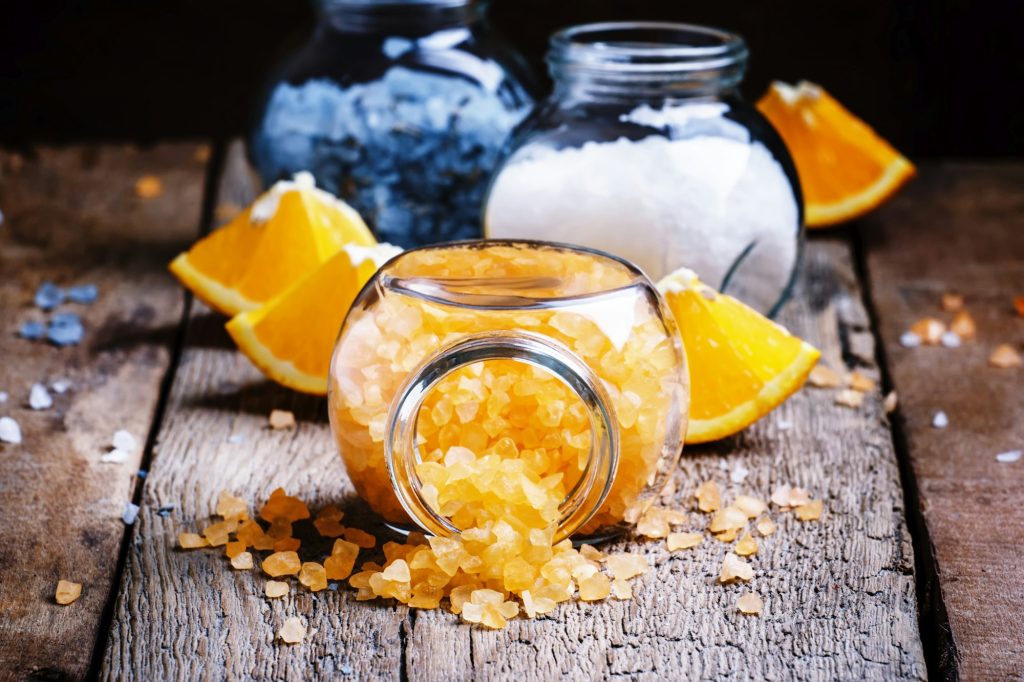 Orange bath salts in a glass jar