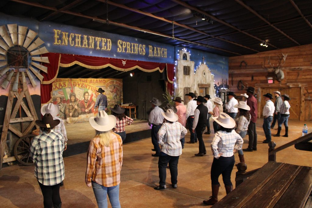 A professional line dancing instructor teaches guests how to do some fun county western line dancing!