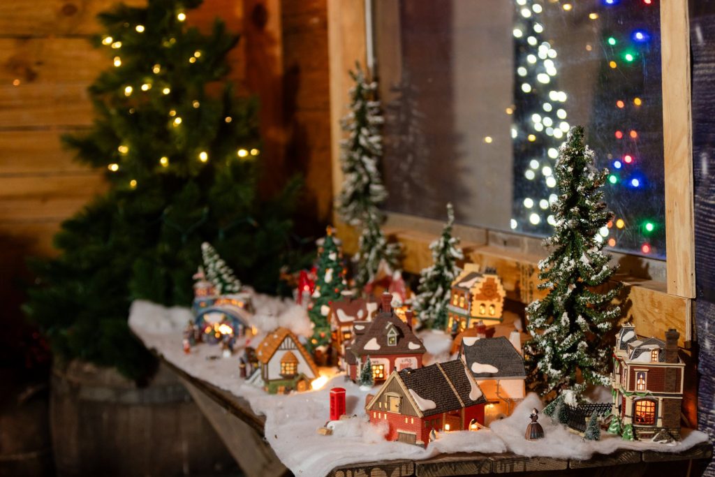 Miniature Christmas village display inside an Old West storefront