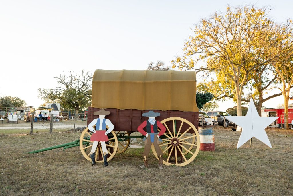 Covered wagon and Christmas star decorations at Enchanted Springs Ranch