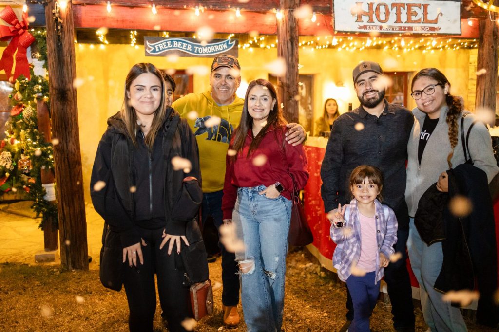 Family enjoying a night out at Old West Christmas Light Fest in Boerne, Texas